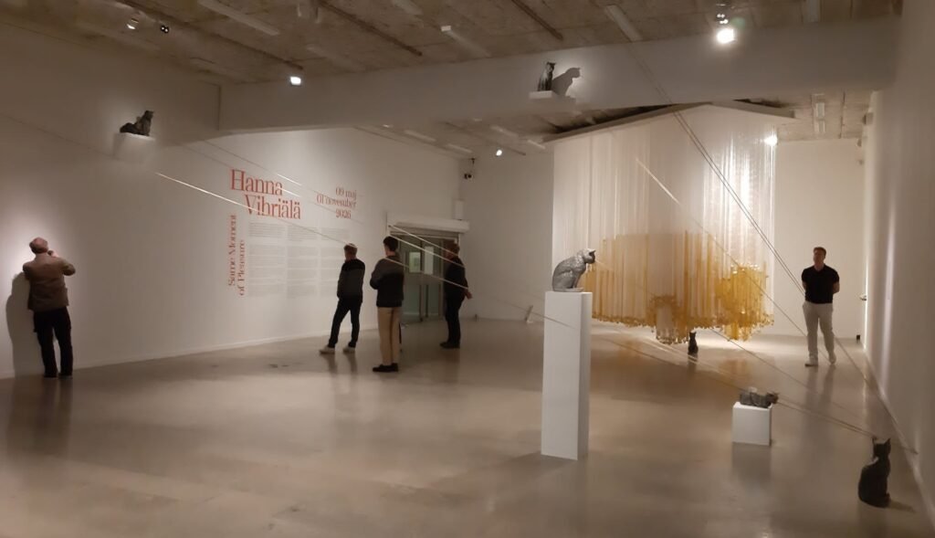 Visitors exploring Hanna Vihriälä's immersive installation at Gothenburg Museum of Art, featuring suspended sculptural elements that transform the gallery space into a sensory environment focused on body, memory, and freedom.