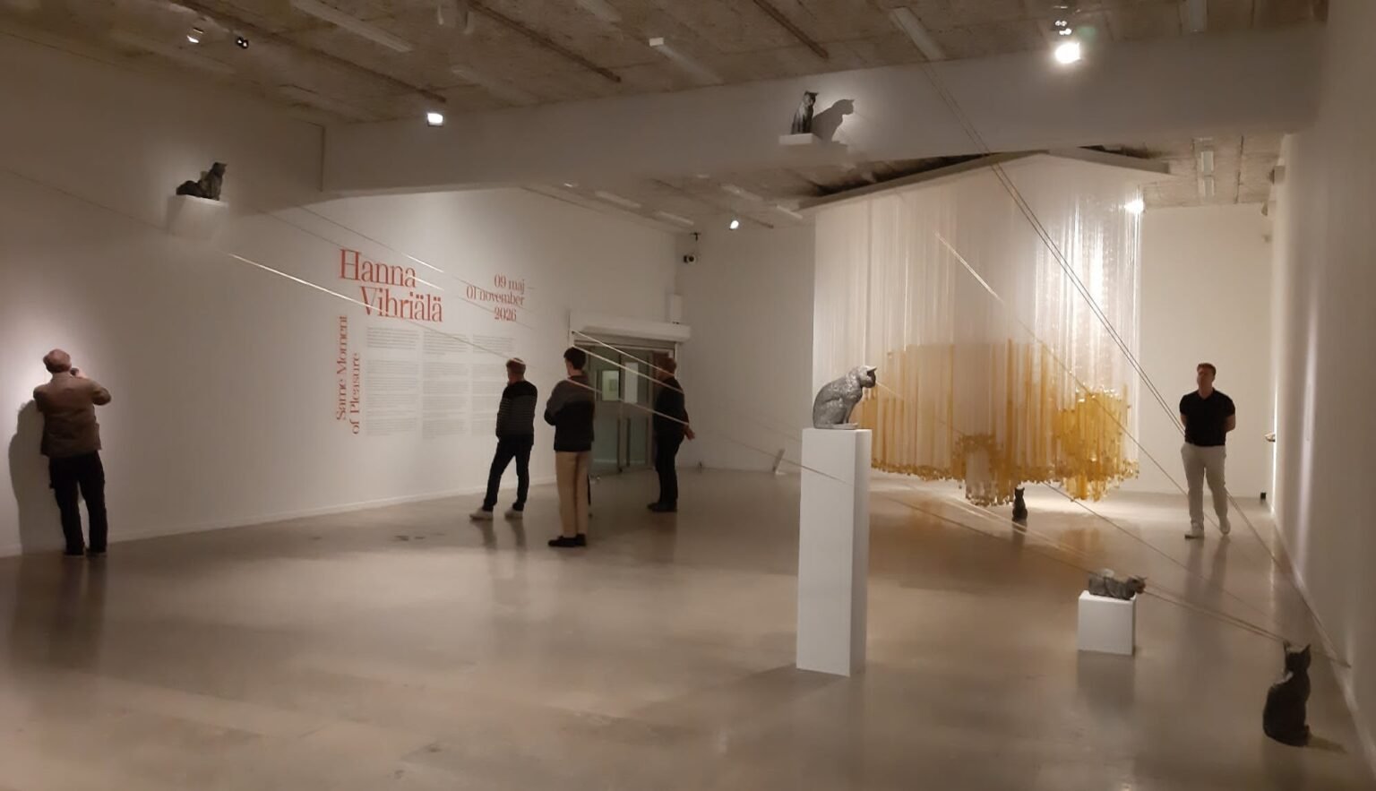 Visitors exploring Hanna Vihriälä's immersive installation at Gothenburg Museum of Art, featuring suspended sculptural elements that transform the gallery space into a sensory environment focused on body, memory, and freedom.
