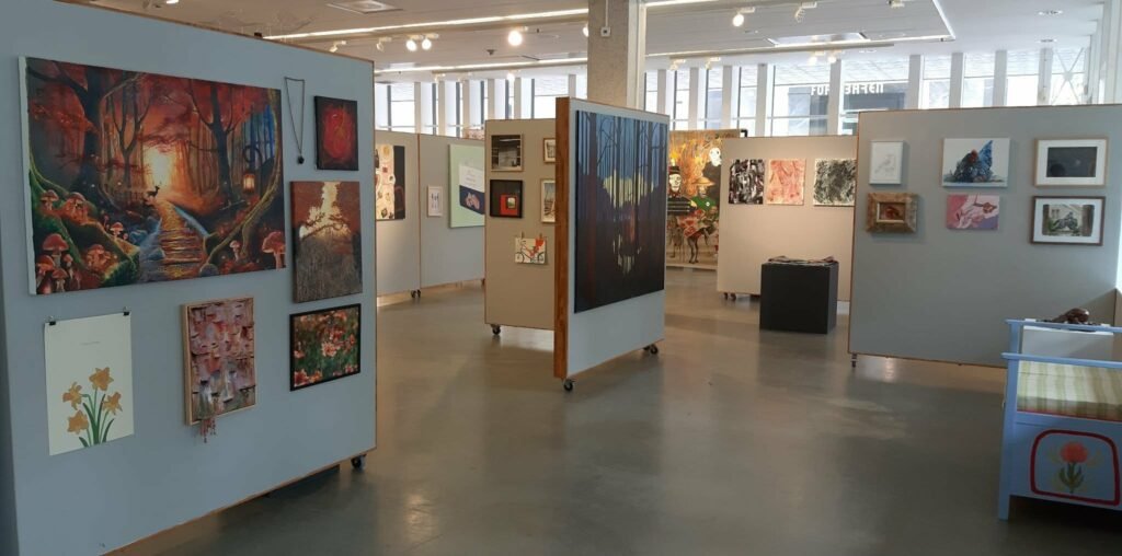 Young artists exhibiting contemporary artworks during Youth Salon 2026 at Gothenburg City Library