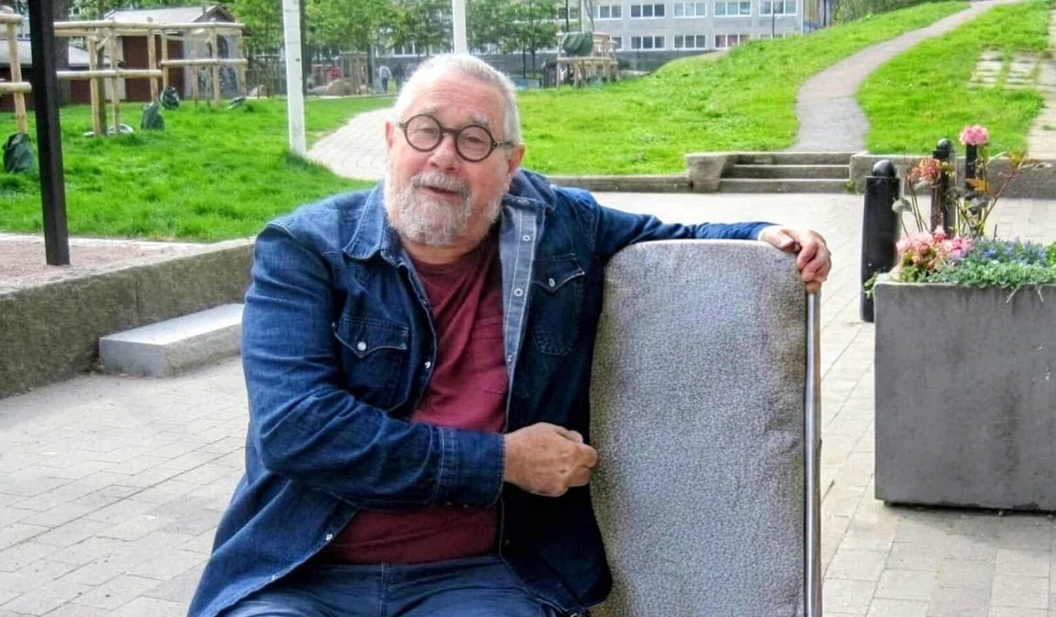 Norberto Daniel Cornaglia, known as Pelusa, sitting outdoors in Hammarkullen near the Mixgården youth center.